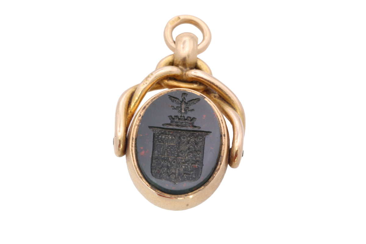 Reverse bloodstone heraldic intaglio on Victorian 18ct gold spinner seal