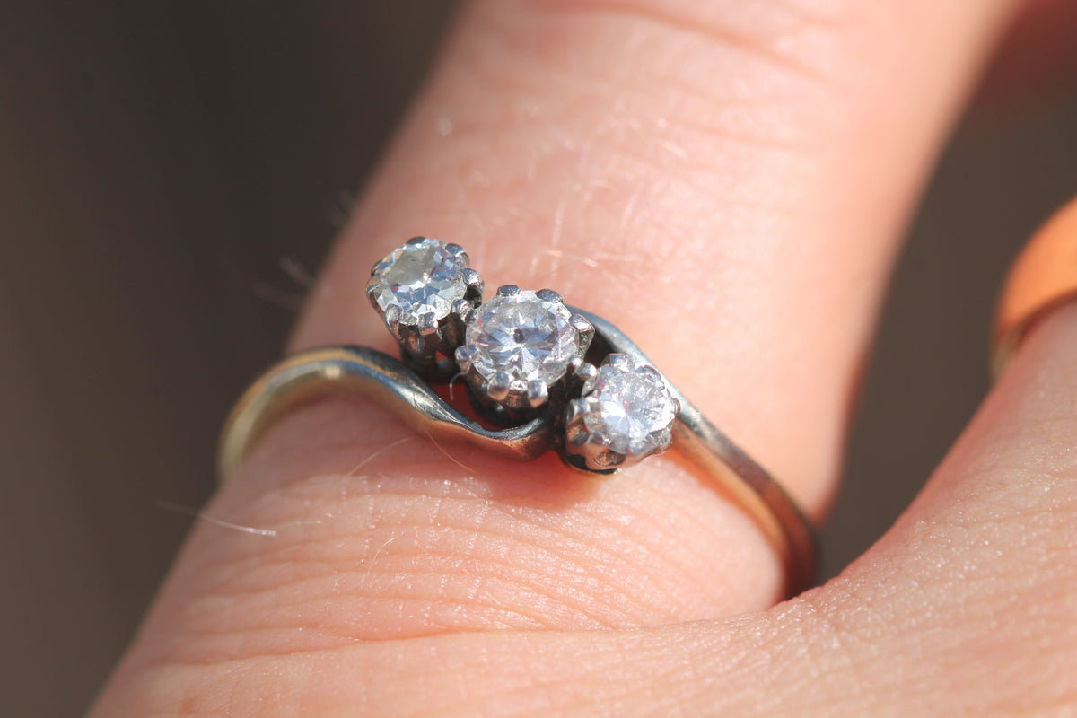 Three transitional brilliant-cut diamonds set across antique 18ct gold ring