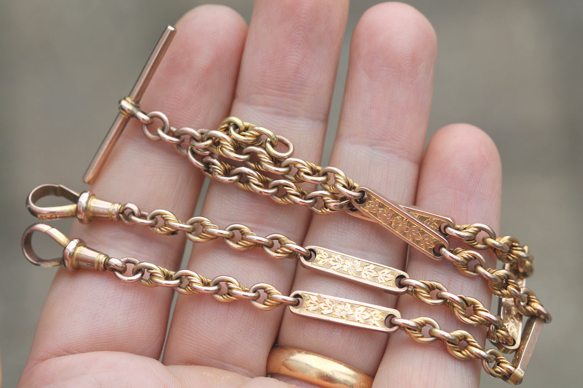 Close-up of forget-me-not chased bar links and twisted lovers knot links