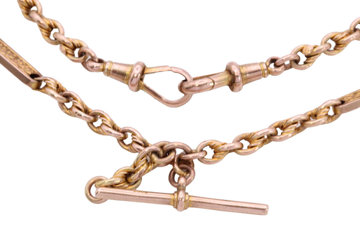 Detailed view of floral engraving on antique 9ct gold Albert chain