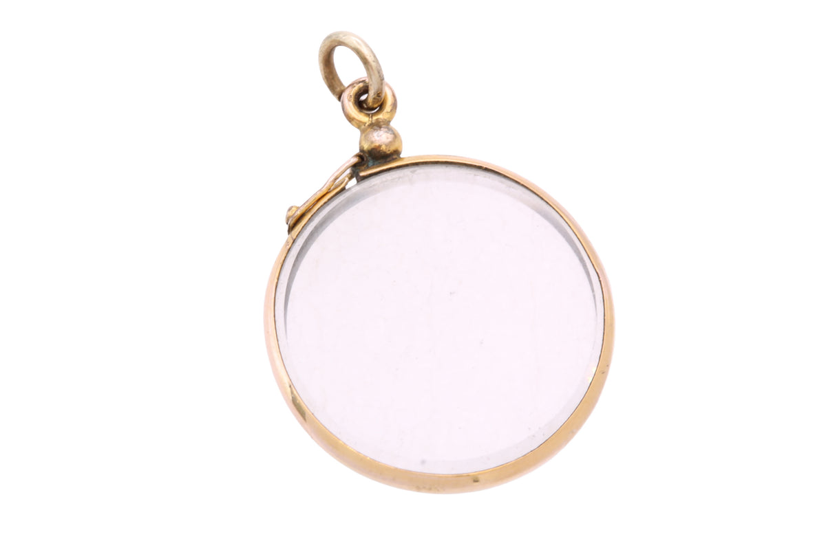 Victorian open locket with two removable circular glass panels