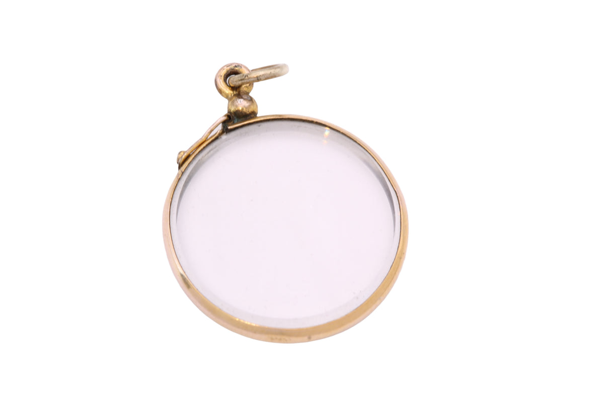 Close-up of antique rolled gold locket suspension and jump ring