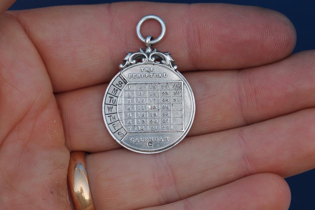 Antique Sterling Silver The Perpetual Calendar Pendant, 1899