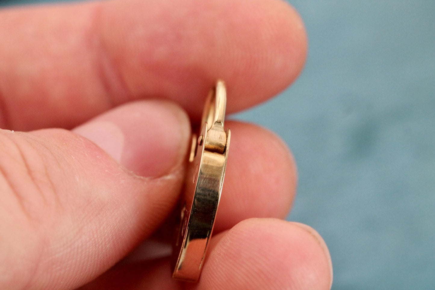 Vintage gold heart padlock clasp shown open with hinged shackle