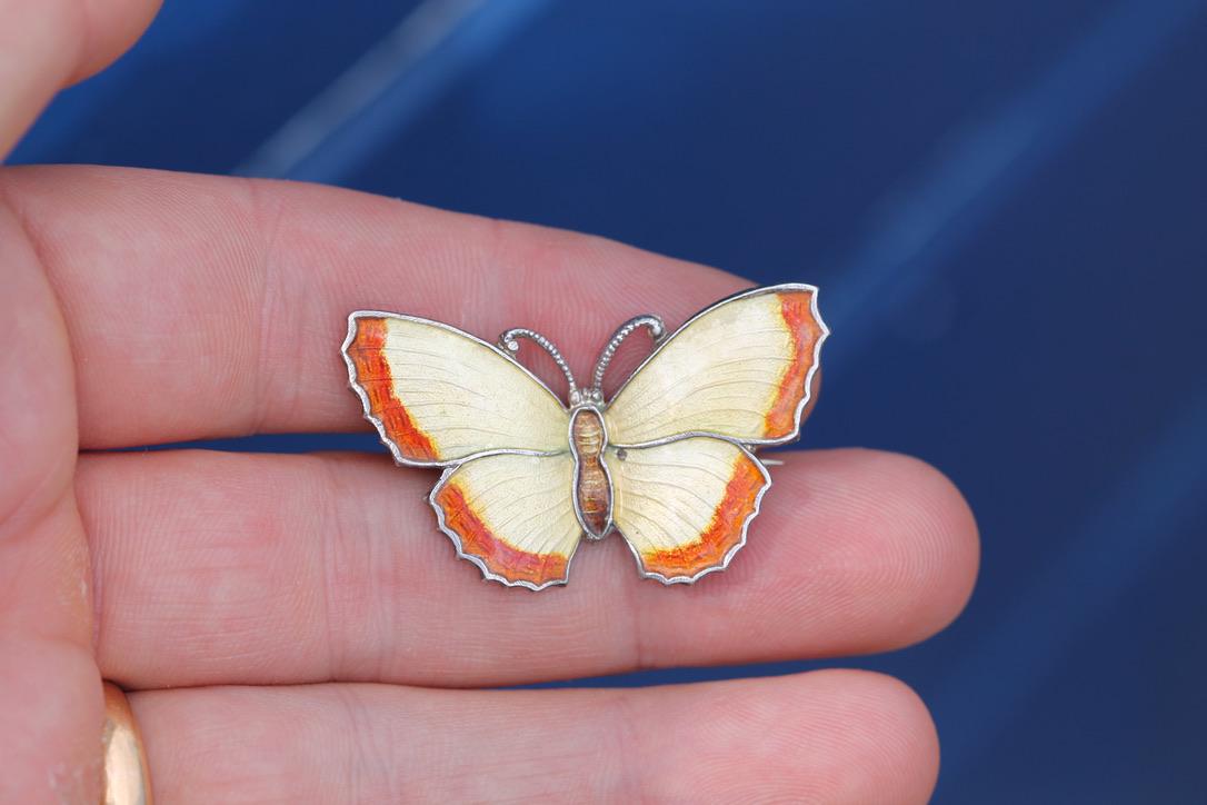 Vintage sterling silver butterfly brooch with cream and orange enamel wings
