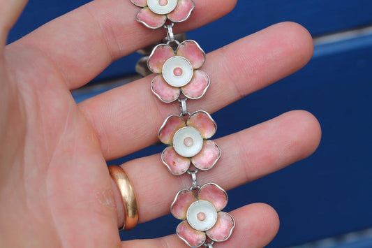 Vintage sterling silver bracelet with linked pink and white enamel flowers